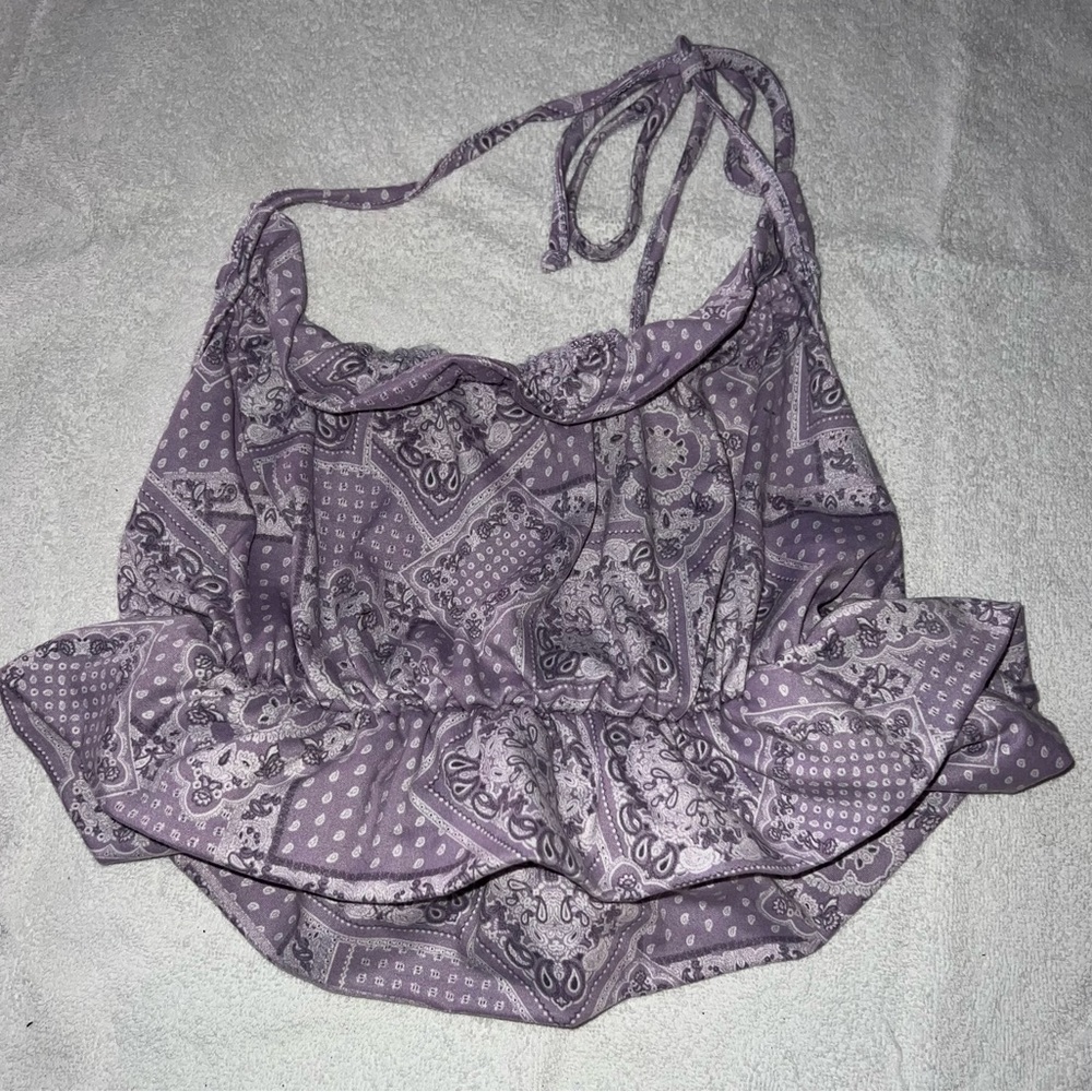 I’m selling this cute purple crop top! It’s bandana designed and super soft.